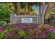 This is the community sign with colorful flowers around it at 4165 Eva Bay Dr., Murrells Inlet, SC 29576