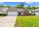 Charming single-story home with brick accents, manicured lawn, and a two-car garage at 4165 Eva Bay Dr., Murrells Inlet, SC 29576