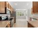 Efficient kitchen with stainless steel appliances, laminate counters, and eat-in breakfast area at 4165 Eva Bay Dr., Murrells Inlet, SC 29576