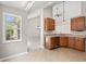 Well-lit kitchen showcasing wooden cabinets and an efficient layout at 4165 Eva Bay Dr., Murrells Inlet, SC 29576