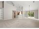 Spacious living room with vaulted ceilings, carpet, and a view to the kitchen at 4165 Eva Bay Dr., Murrells Inlet, SC 29576