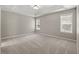 Bright, spacious main bedroom with carpet, trey ceiling, and plenty of natural light at 4165 Eva Bay Dr., Murrells Inlet, SC 29576