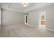 Large main bedroom with tray ceiling, neutral walls, carpet and ensuite access at 4165 Eva Bay Dr., Murrells Inlet, SC 29576