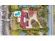 Aerial view of a well-maintained property with a pool, lush landscaping, and beautiful brick drive at 4204 N Ocean Blvd., Myrtle Beach, SC 29577