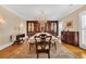 Formal dining room with wood floors, and an elegant chandelier at 4204 N Ocean Blvd., Myrtle Beach, SC 29577