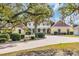 Elegant exterior view with a circular drive and meticulously landscaped front yard at 4204 N Ocean Blvd., Myrtle Beach, SC 29577