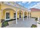 Covered veranda with classic columns, and tiled patio provides elegant outdoor living at 4204 N Ocean Blvd., Myrtle Beach, SC 29577