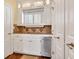 Convenient kitchenette area with granite countertops, stainless steel dishwasher, and white cabinets at 4204 N Ocean Blvd., Myrtle Beach, SC 29577
