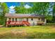 Spacious backyard featuring a red deck, smaller wooden deck, perfect for outdoor entertaining and relaxation at 4391 Party Pines Rd., Conway, SC 29526