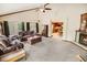 Spacious living room boasting a fireplace, large windows, and seamless access to the kitchen at 4391 Party Pines Rd., Conway, SC 29526