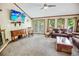 Cozy living room with neutral carpet, ceiling fan, and a large flat-screen TV at 4391 Party Pines Rd., Conway, SC 29526