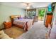Inviting bedroom with plush carpeting, a private deck, and a ceiling fan at 4391 Party Pines Rd., Conway, SC 29526
