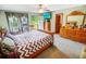 Bright main bedroom with carpeting, an exterior door to a deck, and ample closet space at 4391 Party Pines Rd., Conway, SC 29526