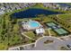 Aerial view showcasing the community pool, tennis courts, and clubhouse, offering a variety of recreational amenities at 4425 Honir Dr., Myrtle Beach, SC 29579