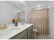 Well-lit bathroom featuring a double vanity with ample countertop space and a shower-tub combination at 4425 Honir Dr., Myrtle Beach, SC 29579