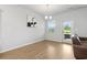 Bright dining room with modern chandelier and patio door at 4425 Honir Dr., Myrtle Beach, SC 29579