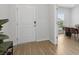 Bright entryway with wood flooring, leading to a dining area, offers a welcoming first impression at 4425 Honir Dr., Myrtle Beach, SC 29579