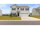 Charming two-story home featuring a two-car garage and well-maintained front yard with nice landscaping at 4425 Honir Dr., Myrtle Beach, SC 29579