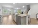 Bright, open-concept kitchen island featuring granite countertops and stainless steel appliances at 4425 Honir Dr., Myrtle Beach, SC 29579