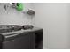 Modern laundry room features front-load washer and dryer with a shelf for storage at 4425 Honir Dr., Myrtle Beach, SC 29579