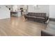 Spacious living room with a stylish sofa, adjacent to the kitchen at 4425 Honir Dr., Myrtle Beach, SC 29579