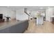 Bright, open-concept living space featuring an island and staircase at 4425 Honir Dr., Myrtle Beach, SC 29579