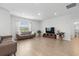 Bright living room with modern furnishings, natural light, and an open layout at 4425 Honir Dr., Myrtle Beach, SC 29579
