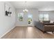 Open-concept living room with a view to backyard and modern furnishings at 4425 Honir Dr., Myrtle Beach, SC 29579