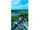 Aerial view of a condo community near a golf course and waterway, showcasing the neighborhood's lush landscape at 4449 Turtle Ln. # 3A, Little River, SC 29566