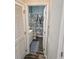 Bathroom features a shower with a beach themed curtain, white cabinets, and modern flooring at 4449 Turtle Ln. # 3A, Little River, SC 29566