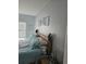 Bright bedroom with a light blue bedspread, light blue walls, and beach themed wall art at 4449 Turtle Ln. # 3A, Little River, SC 29566