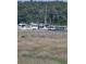 Picturesque waterfront featuring multiple boats and docks surrounded by lush greenery at 4449 Turtle Ln. # 3A, Little River, SC 29566