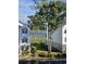 View of condo units overlooking a waterway, with manicured landscaping and trees at 4449 Turtle Ln. # 3A, Little River, SC 29566