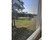 Scenic golf course view with lush green fairways, mature trees, and a tranquil pond at 4449 Turtle Ln. # 3A, Little River, SC 29566