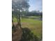 Scenic golf course view with lush green fairways, mature trees, and a tranquil pond at 4449 Turtle Ln. # 3A, Little River, SC 29566