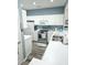 Charming kitchen with white cabinets, stainless steel appliances, and modern countertops at 4449 Turtle Ln. # 3A, Little River, SC 29566