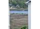 Scenic waterfront homes with private docks and lush marshland views from condo balcony at 4449 Turtle Ln. # 3A, Little River, SC 29566