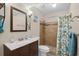 Updated bathroom with new vanity, mirror, lighting, and tiled shower with coastal accents at 4500 S Ocean Blvd. # 4, North Myrtle Beach, SC 29582