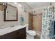 Bathroom featuring a wood look tiled walk-in shower and a modern vanity at 4500 S Ocean Blvd. # 4, North Myrtle Beach, SC 29582