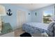 Blue bedroom featuring nautical decor, a window with outside views, and a double bed at 4500 S Ocean Blvd. # 4, North Myrtle Beach, SC 29582