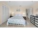 Comfortable bedroom with neutral tones, coastal themed quilt, and ample closet space at 4500 S Ocean Blvd. # 4, North Myrtle Beach, SC 29582
