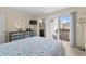 Bright bedroom featuring a balcony, flat screen tv, and natural light at 4500 S Ocean Blvd. # 4, North Myrtle Beach, SC 29582
