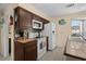 Charming kitchen with stainless appliances, tiled countertops, and ample natural light from large window at 4500 S Ocean Blvd. # 4, North Myrtle Beach, SC 29582