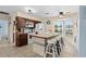 Kitchen features modern appliances, tiled countertops, an island with barstool seating and a sunlit window at 4500 S Ocean Blvd. # 4, North Myrtle Beach, SC 29582