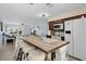 Modern kitchen with an island featuring barstool seating, stainless appliances, and an open floorplan at 4500 S Ocean Blvd. # 4, North Myrtle Beach, SC 29582