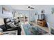 Comfortable living room with a black leather sofa, and sliding doors that lead to an outdoor balcony at 4500 S Ocean Blvd. # 4, North Myrtle Beach, SC 29582