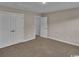 Spacious bedroom featuring carpet floors and access to multiple closets at 489 Rose Fountain Dr., Myrtle Beach, SC 29579