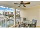 Cozy balcony featuring a table and chairs, offering serene waterfront views at 502 48Th Ave. S # 402, North Myrtle Beach, SC 29582