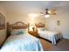 Comfortable bedroom features two twin beds, ceiling fan, and dresser with decorative lamp at 502 48Th Ave. S # 402, North Myrtle Beach, SC 29582