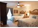 Cozy bedroom features two twin beds, ceiling fan and natural light from the large window at 502 48Th Ave. S # 402, North Myrtle Beach, SC 29582